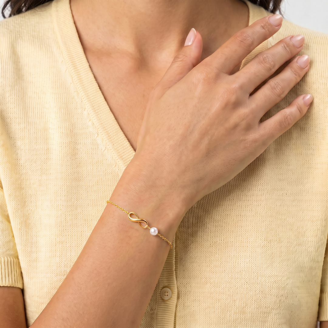 9K Yellow Gold Freshwater Pearl Infinity Bracelet worn on wrist