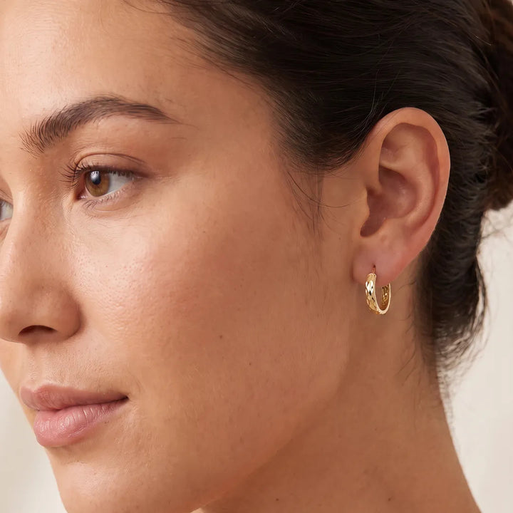 9K Yellow Gold Diamond Cut Hoop Earrings 10mm shown worn on the ear