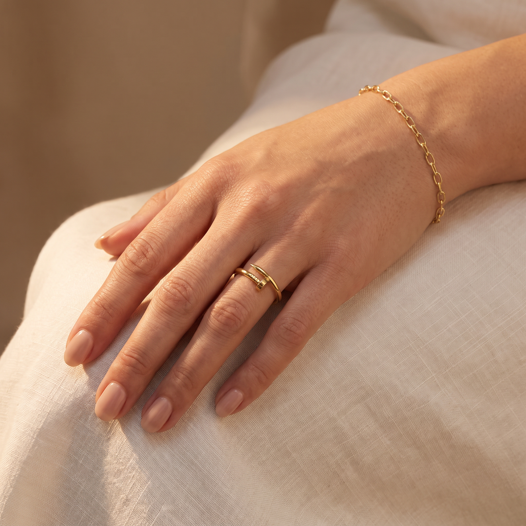 9K Yellow Gold Nail Ring lifestyle shot with matching gold bracelet