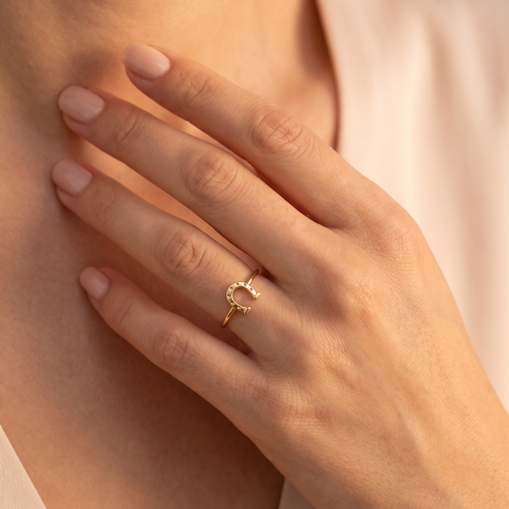 9K Yellow Gold Lucky Horseshoe Ring worn on model's hand