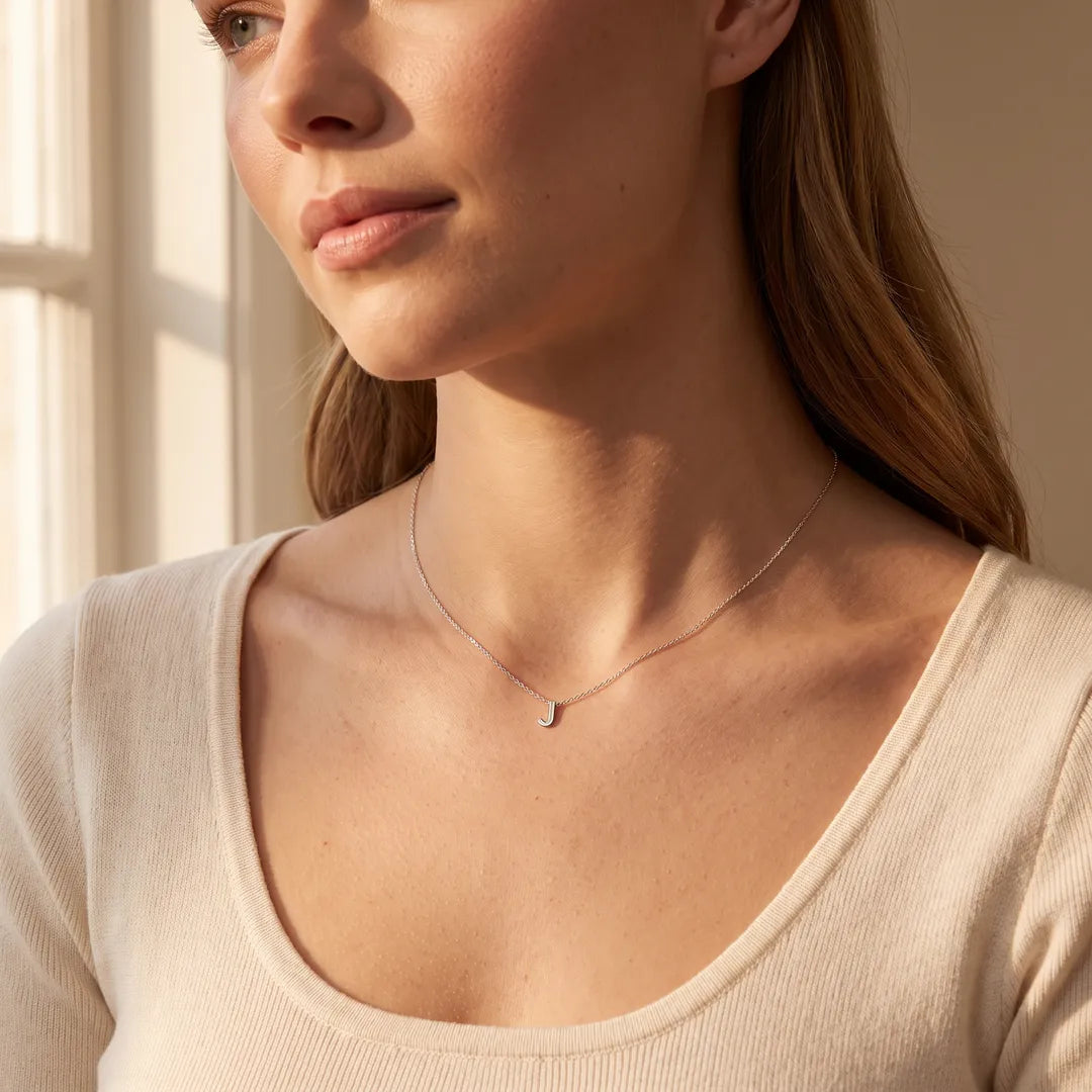 Model wearing the 9K White Gold 'J' Initial Adjustable Letter Necklace