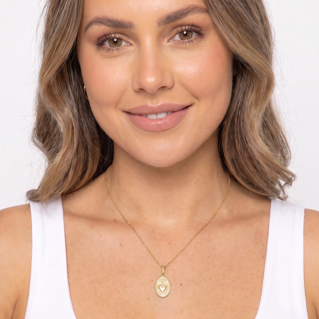 9K Yellow Gold Sacred Heart Pendant worn as a necklace