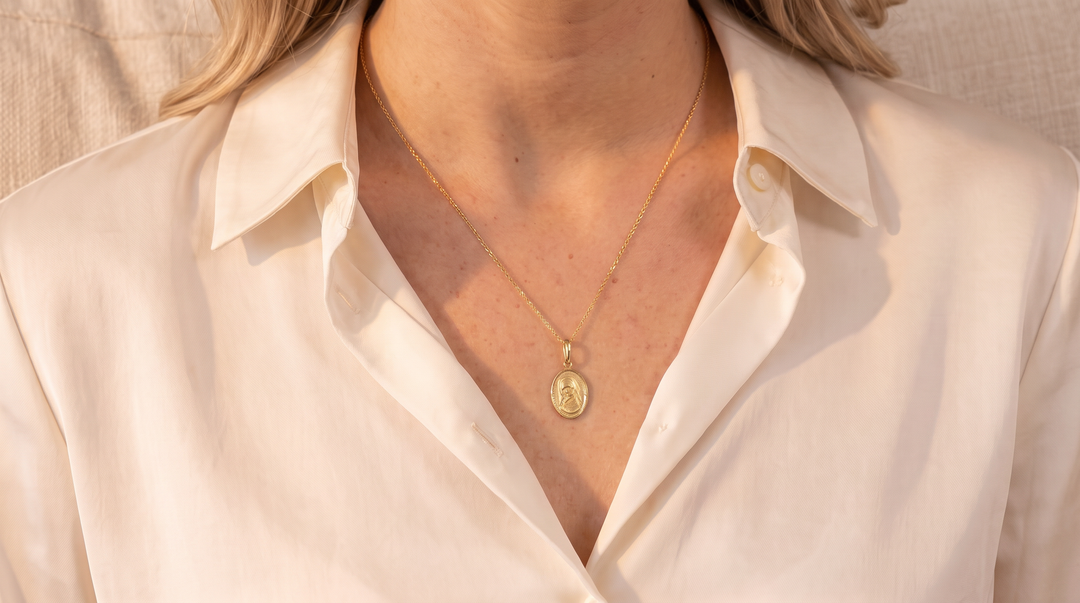 9K Yellow Gold Oval Mary Pendant worn on model, lifestyle shot