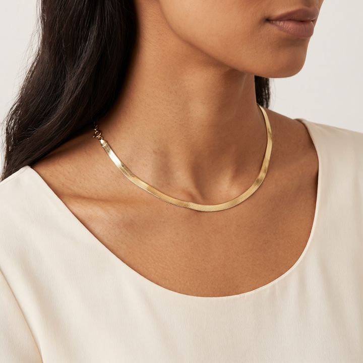 9K Yellow Gold Herringbone Necklace 41cm worn on model - collarbone shot