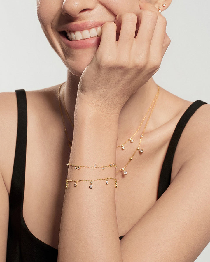 Gold Bezel-Set Teardrop Dangle Station Bracelet