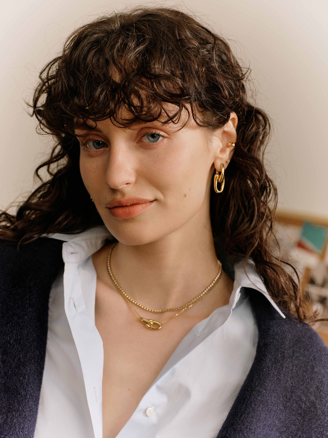Gold Sculptural Interlocking Huggie Hoop Earrings