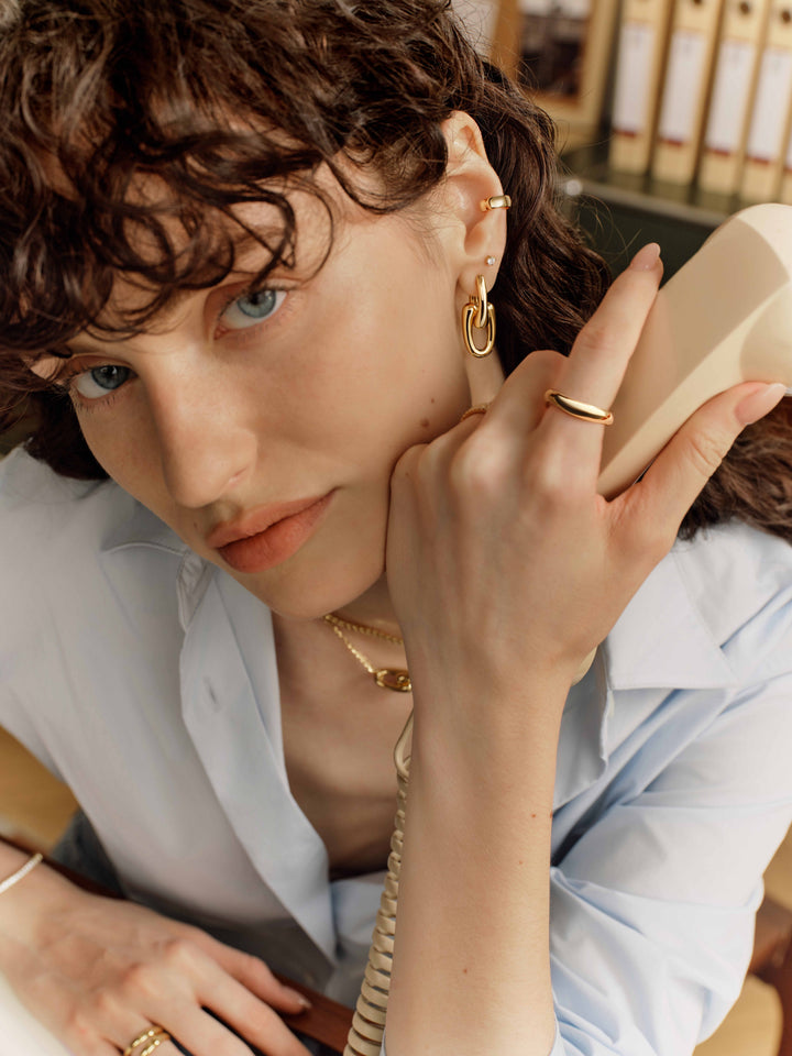 Gold Sculptural Interlocking Huggie Hoop Earrings