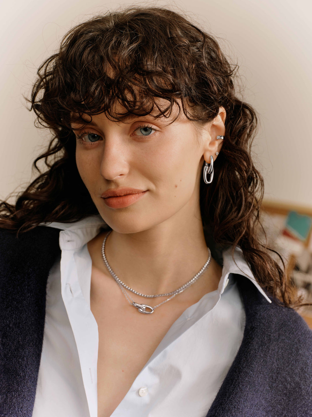 Silver Sculptural Interlocking Huggie Hoop Earrings