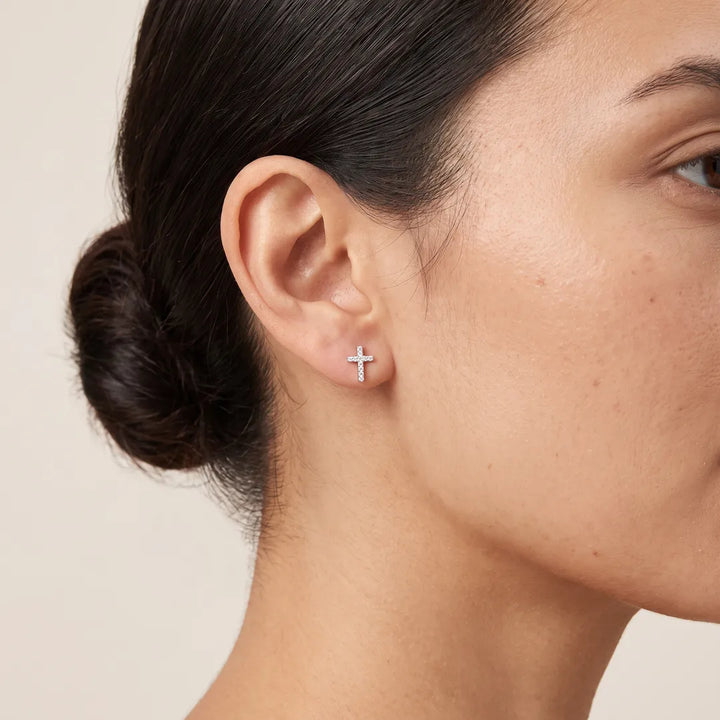 0.03ct Diamond Cross Stud Earrings in 9K White Gold worn on model's ear - ER-72561-003-W