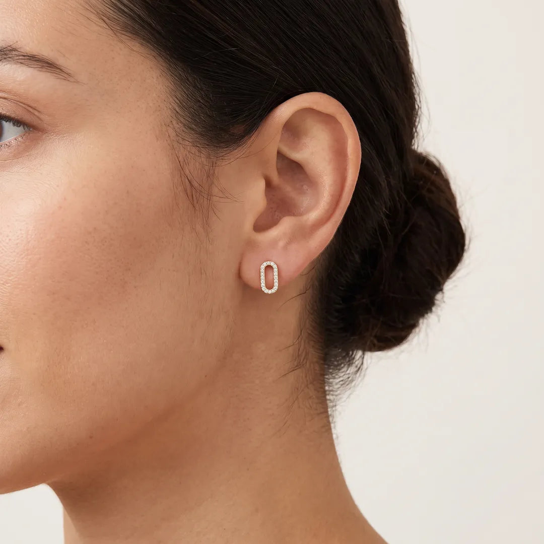 0.14ct Diamond Open Oval Stud Earrings in 9K Yellow Gold worn on model's ear - ER-72564-014-Y