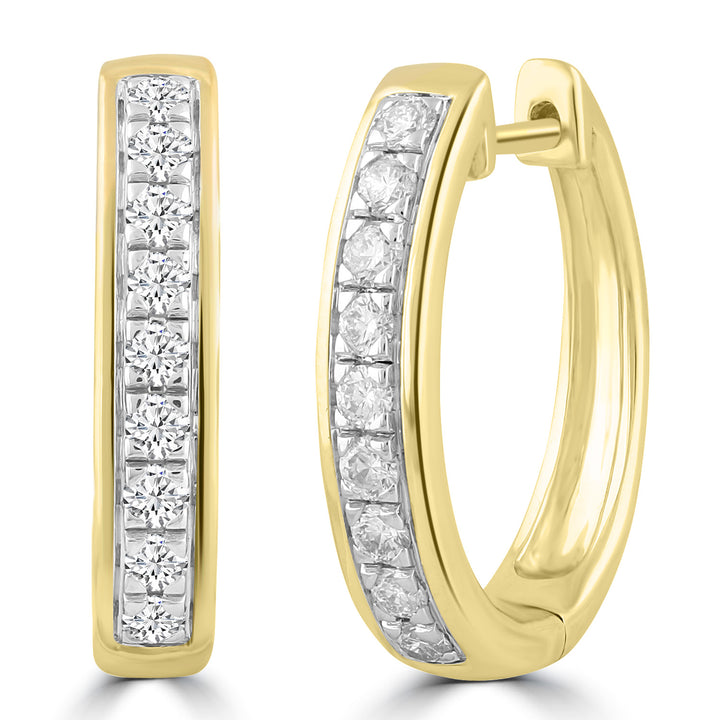 9K yellow gold huggie hoop earrings with channel-set round brilliant diamonds.
