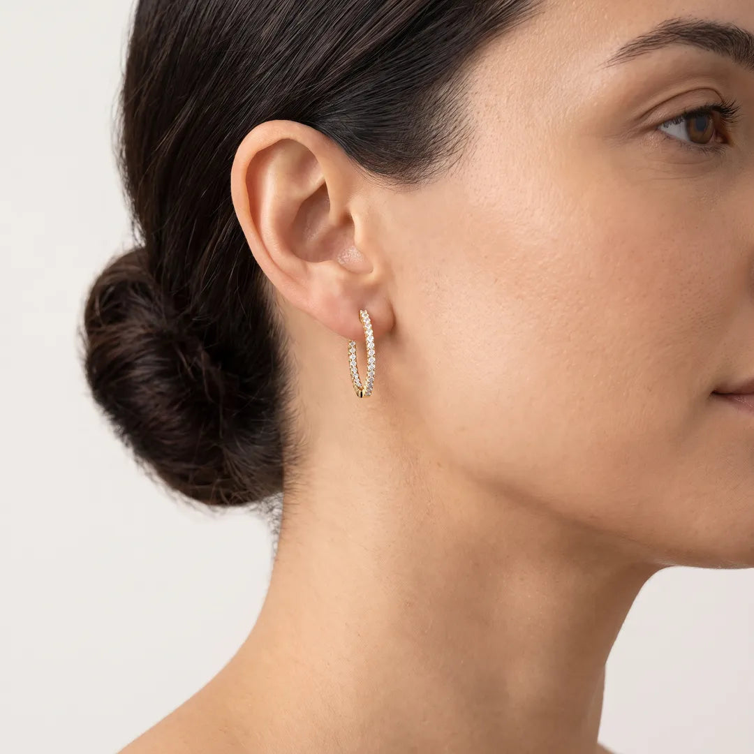 Inside Out Hoops with 0.25ct Diamonds in 9K Yellow Gold worn on model's ear - IGE-13251-025-Y