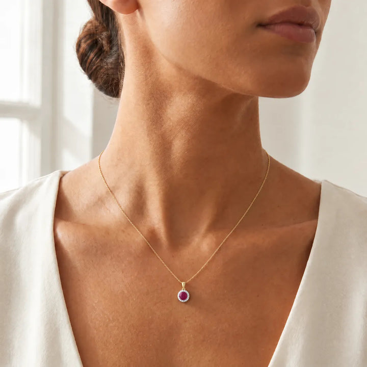 Ruby Pendant with 0.03ct Diamonds in 9K Yellow Gold worn on a fine gold chain
