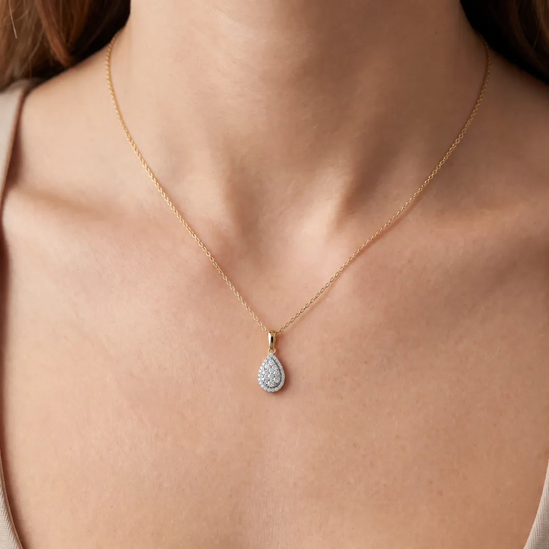 Pear Pendant with 0.25ct Diamond in 9K Yellow Gold worn on a fine gold chain, on model