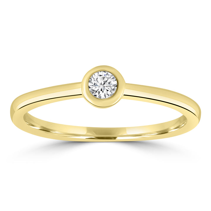 A delicate 9K yellow gold solitaire ring featuring a 0.10ct round brilliant-cut diamond.