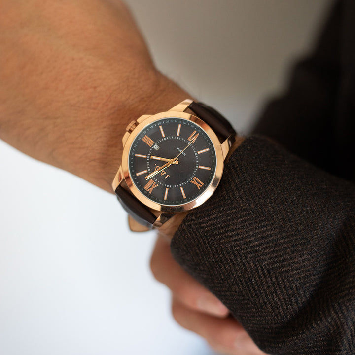 Jag Xavier blue stainless steel 44mm watch with brown leather strap on a man's wrist
