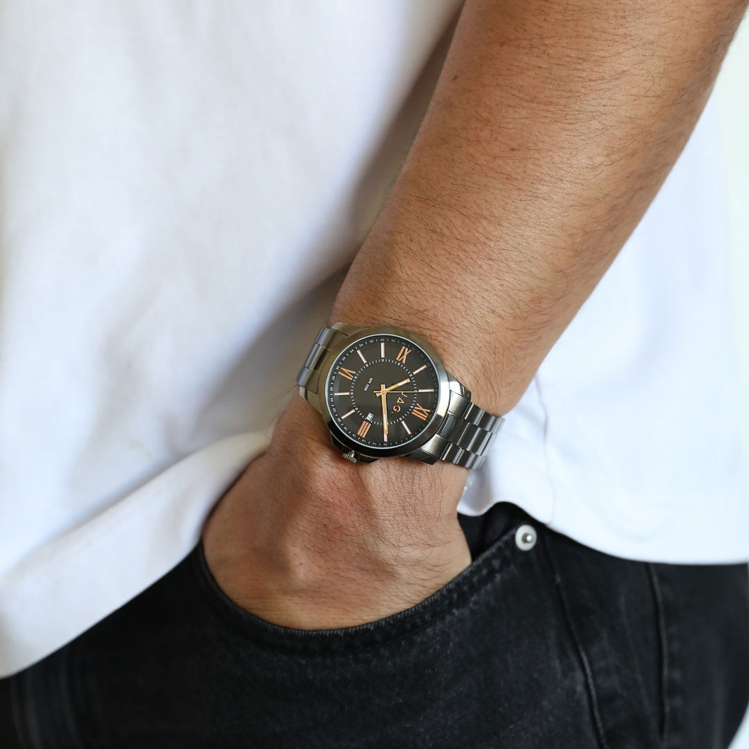 Man wearing a Jag Xavier black stainless steel 44mm watch on his wrist.