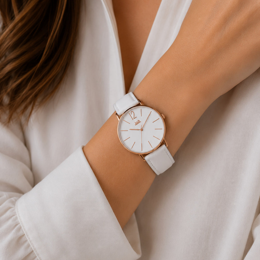 Jag Billy white leather 40mm watch with rose gold case on a woman's wrist