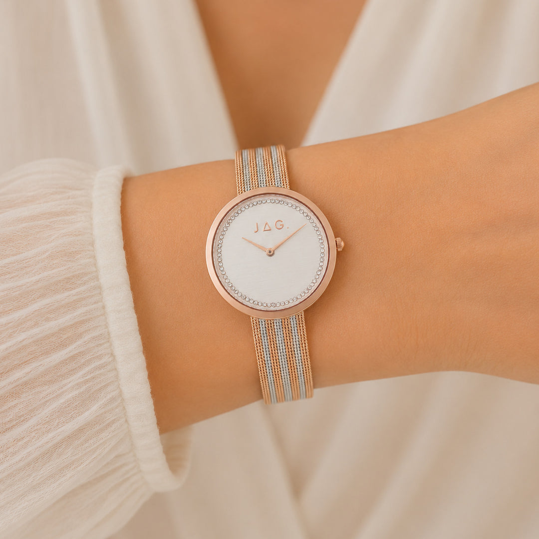 Jag Tegan white alloy 34mm watch with rose gold accents on a mesh strap.
