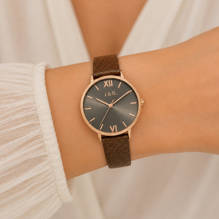 Jag ladies dark grey alloy watch with brown snake-effect strap and rose gold casing.