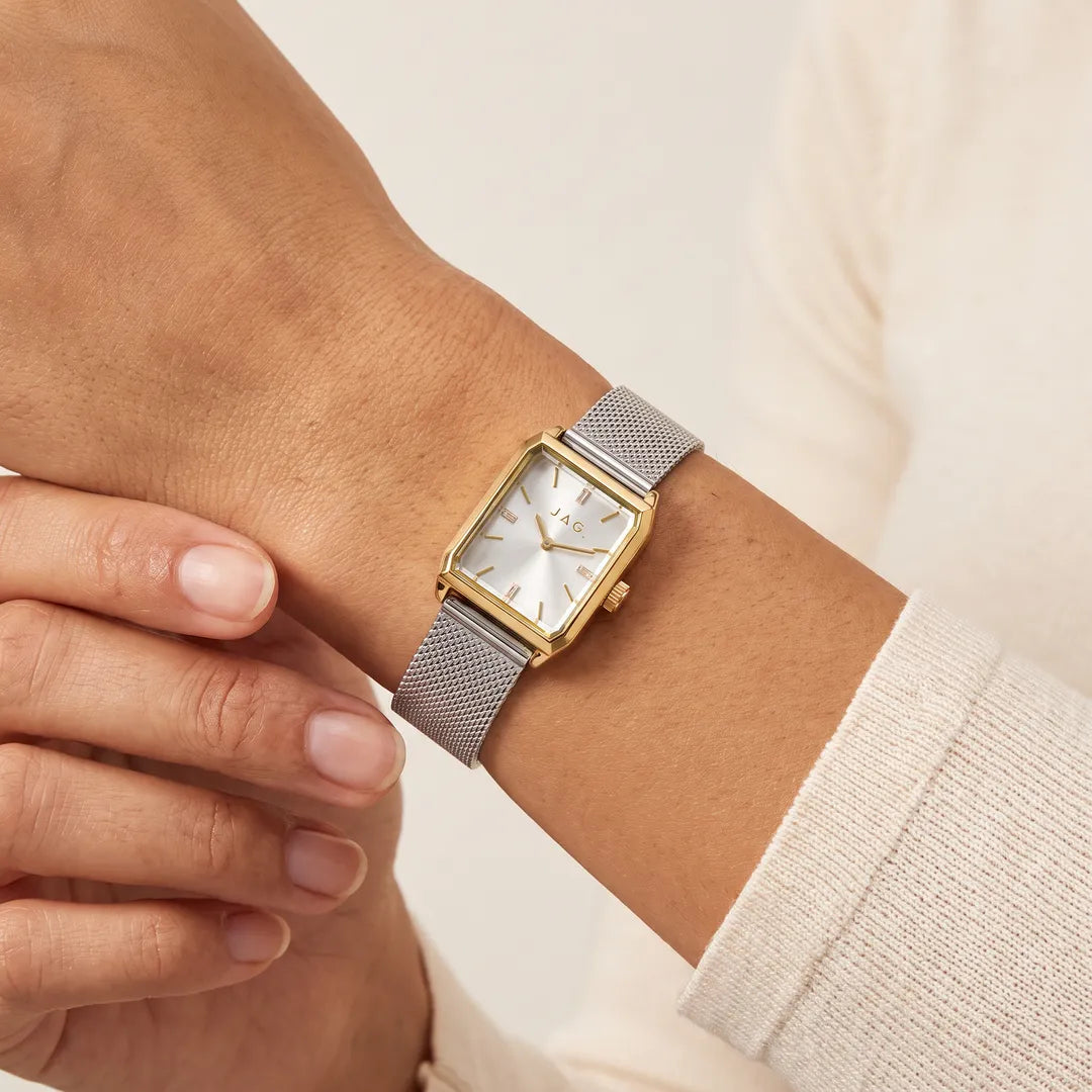 Jag Sorrento womens 24mm silver dial gold case watch with silver mesh strap worn on wrist