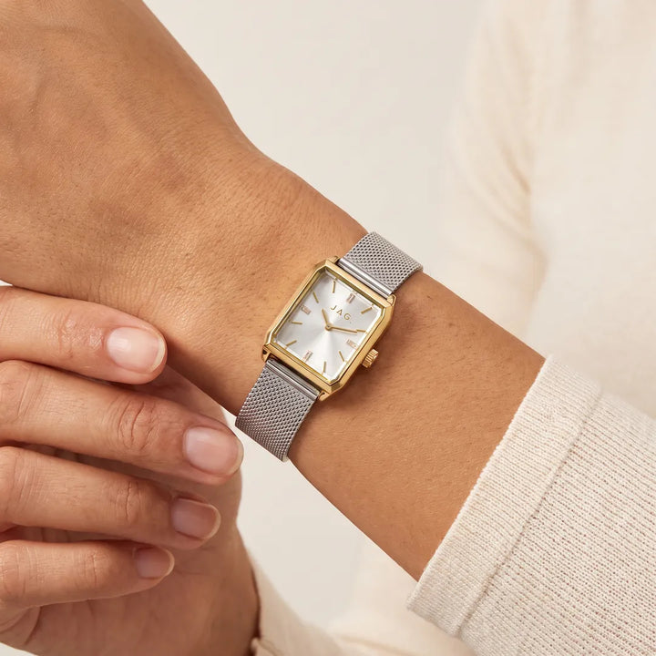 Jag Sorrento womens 24mm silver dial gold case watch with silver mesh strap worn on wrist
