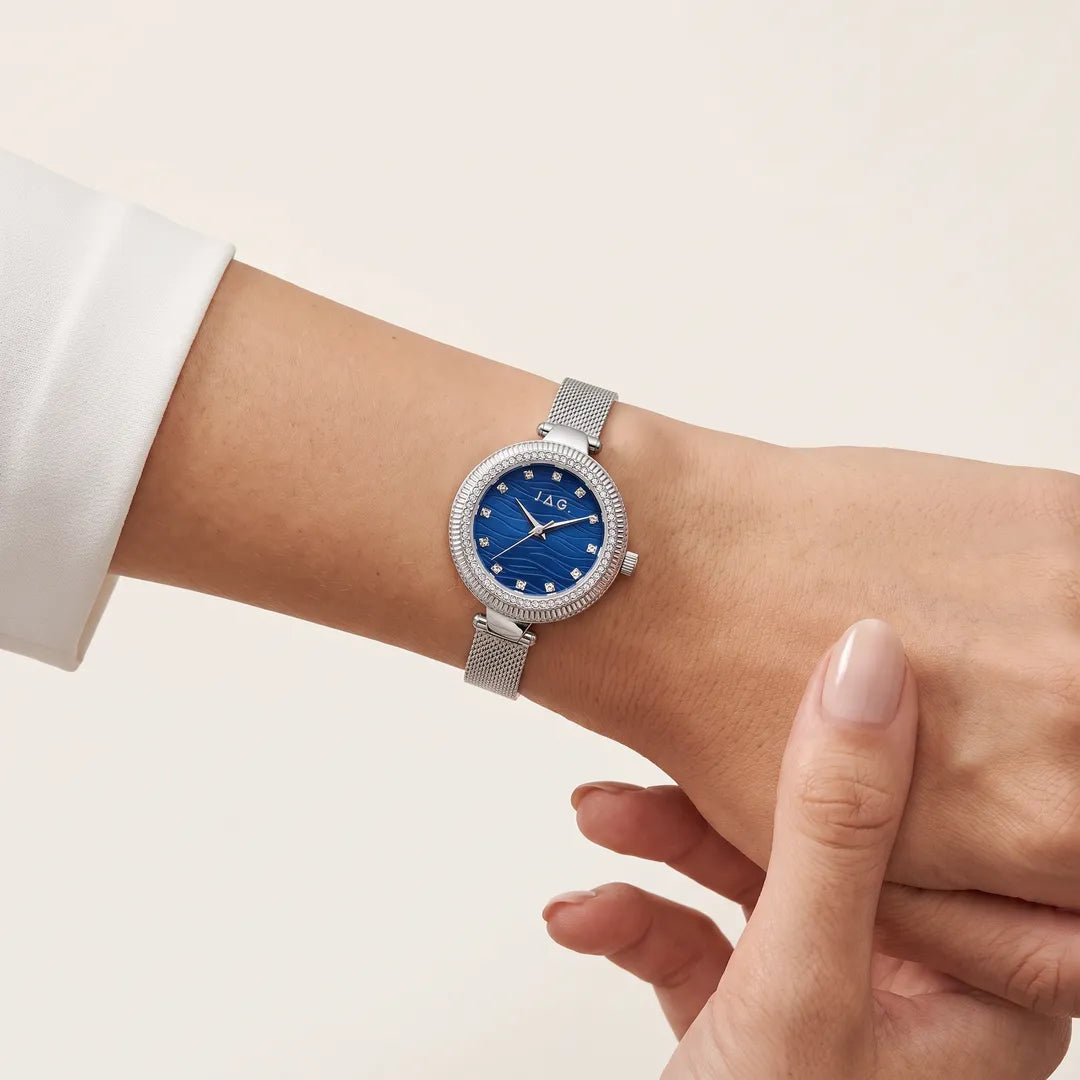 Jag Maddy Womens Blue Dial 31mm Silver Mesh Watch worn on wrist