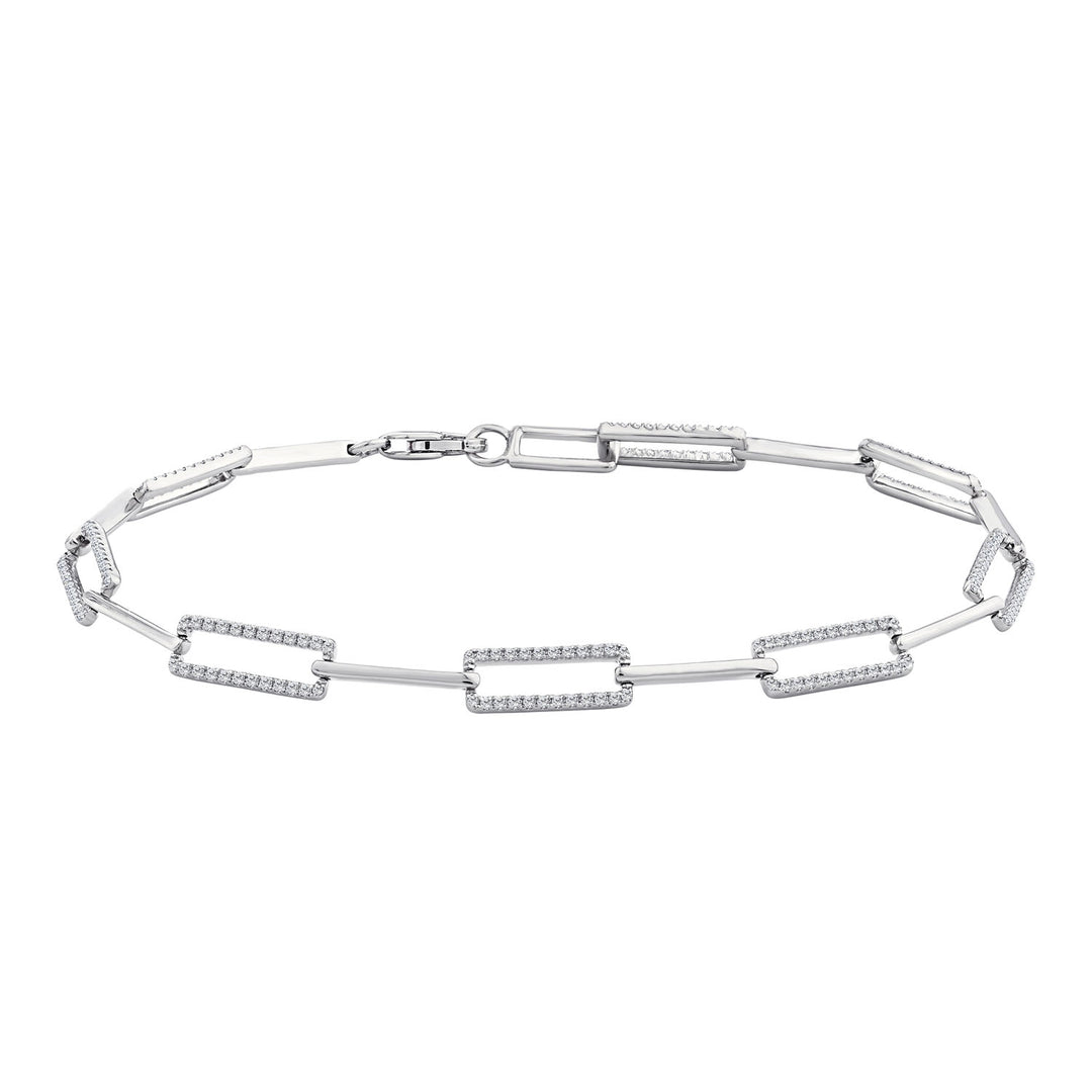 Silver bracelet with diamond accents on a white background