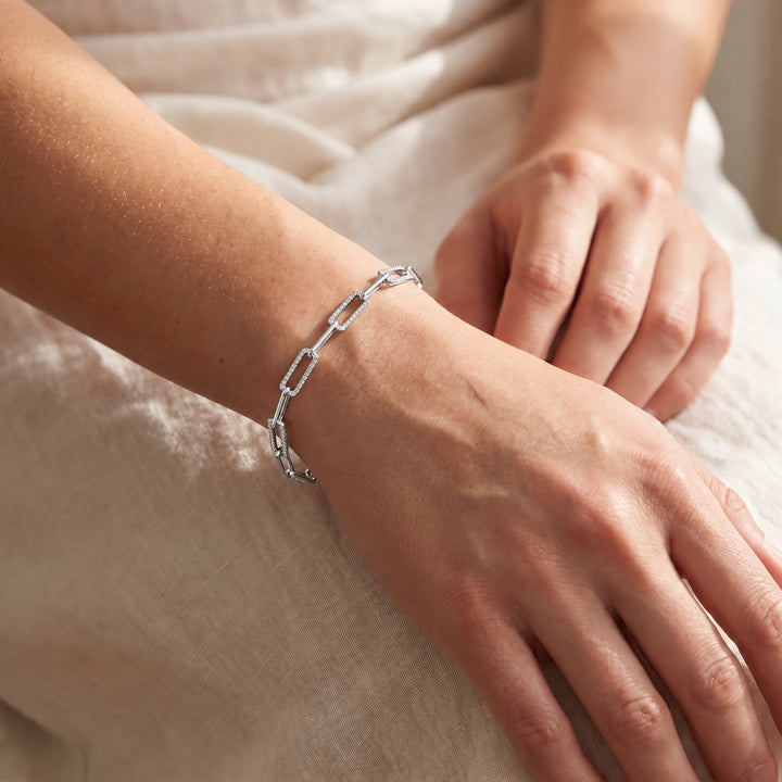 0.50ct Lab Grown Diamond Paperclip Bracelet in 9K White Gold worn on a woman's wrist