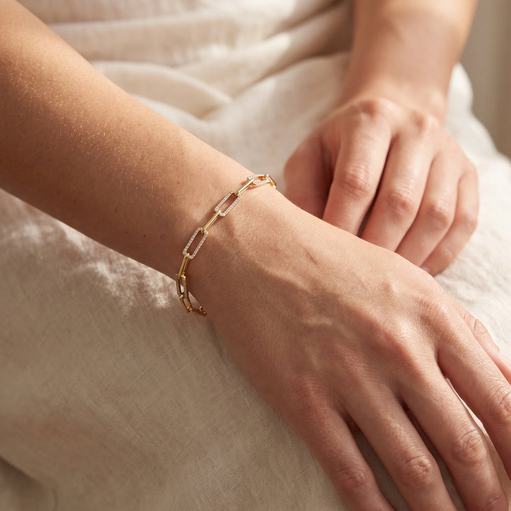 0.50ct Lab Grown Diamond Paperclip Bracelet in 9K Yellow Gold worn on a woman's wrist