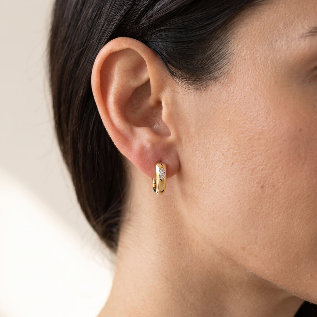 0.20ct Marquise Lab Grown Diamond Huggie Earrings in 9K Yellow Gold worn on model