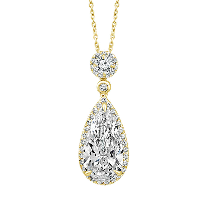 A yellow gold pendant necklace featuring a teardrop-shaped diamond pendant surrounded by a halo of smaller diamonds, with a round diamond setting above and a delicate gold chain, shown on a plain white background.