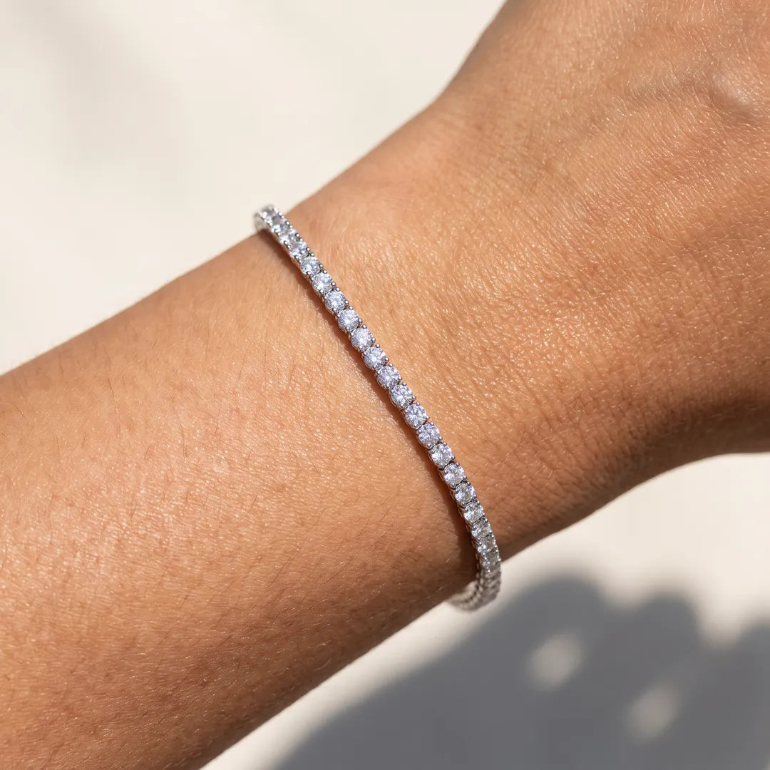 3.00ct lab grown diamond tennis bracelet in 9K white gold worn on a woman's wrist