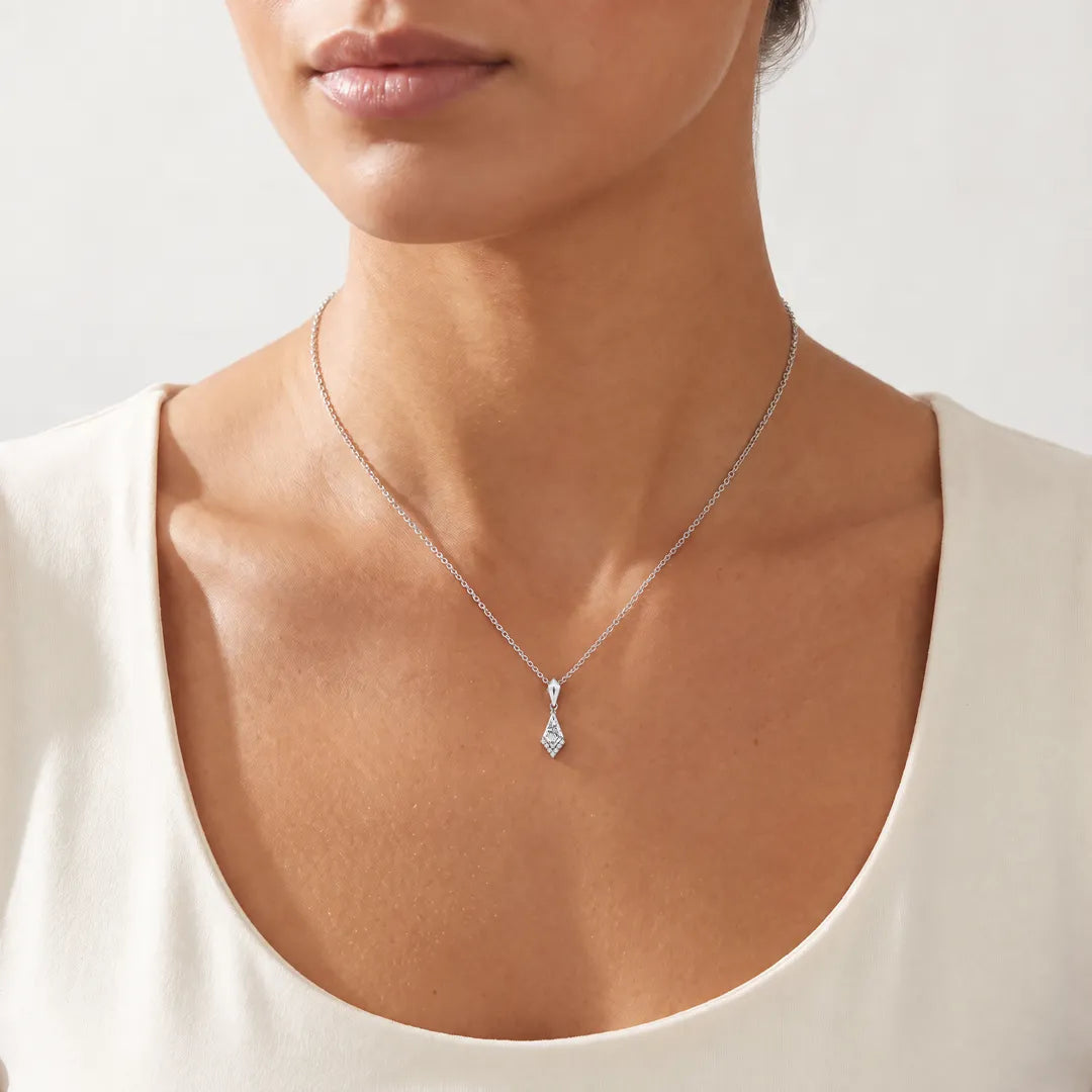 0.33ct Kite Lab Grown Diamond Asterly Necklace in 9K White Gold worn on a model, showing the petite kite pendant on a fine chain at the collarbone