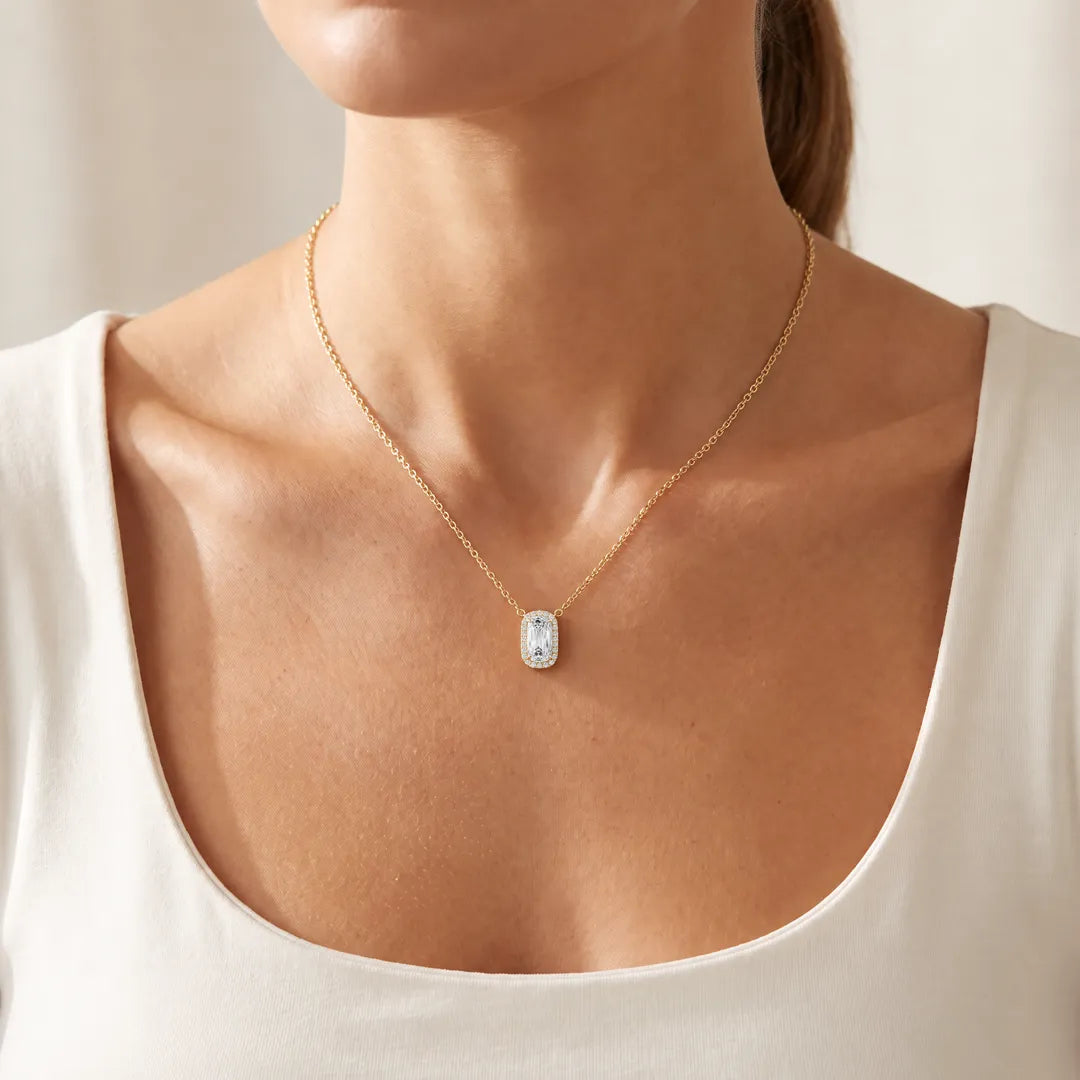 2.15ct Lab Grown Diamond Northern Ray Necklace in 18K Yellow Gold worn on a model, elongated cushion-cut diamond with round diamond halo on a fine yellow gold chain