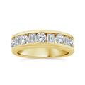 A gold diamond eternity ring featuring a row of baguette and round-cut diamonds set in a polished silver band, shown against a plain white background.