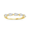 A yellow gold ring featuring five pear-cut clear gemstones set in a curved row, shown against a plain white background.