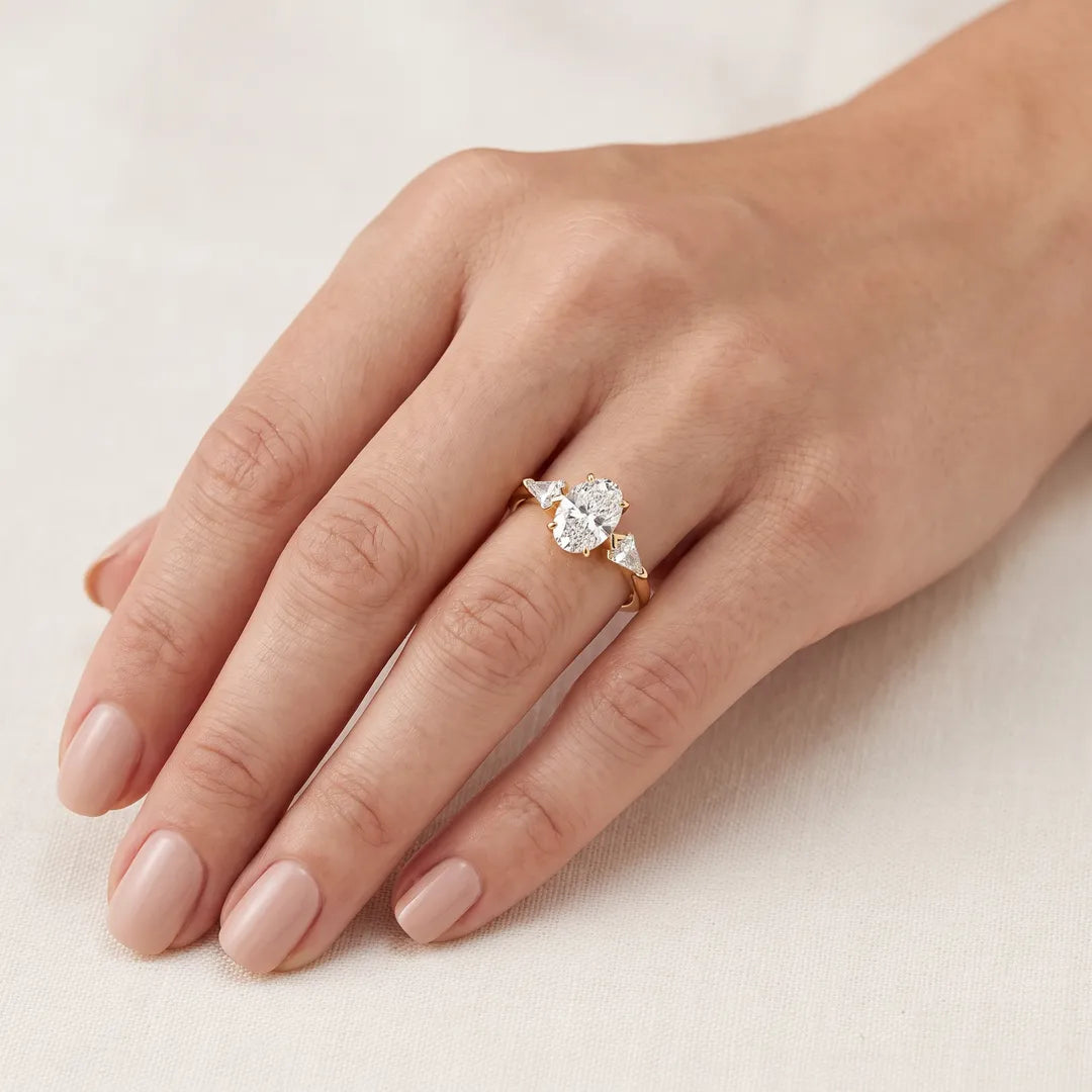 1.95ct Oval Lab Grown Diamond Stone Ring in 9K Yellow Gold worn on a model's hand