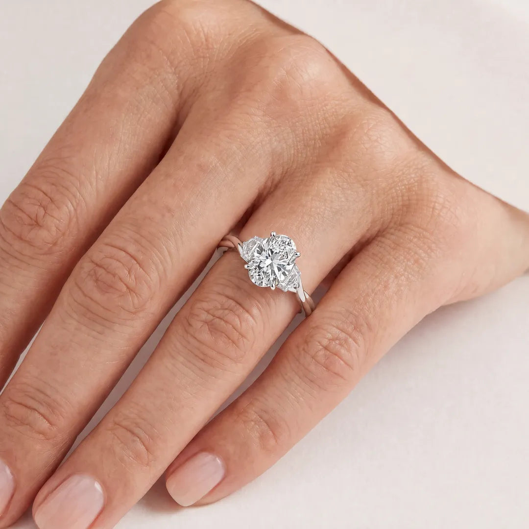 2.45ct Oval Lab Grown Diamond Twist Ring in 9K White Gold worn on a model's hand