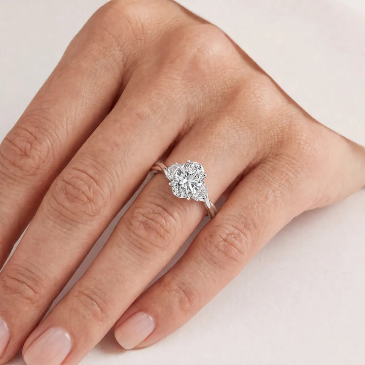 2.45ct Oval Lab Grown Diamond Twist Ring in 9K White Gold worn on a model's hand