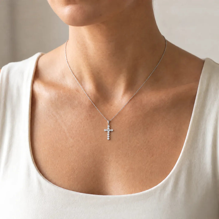 1.00ct Lab Grown Diamond Cross Pendant in 9K White Gold worn on a fine white gold chain on a model