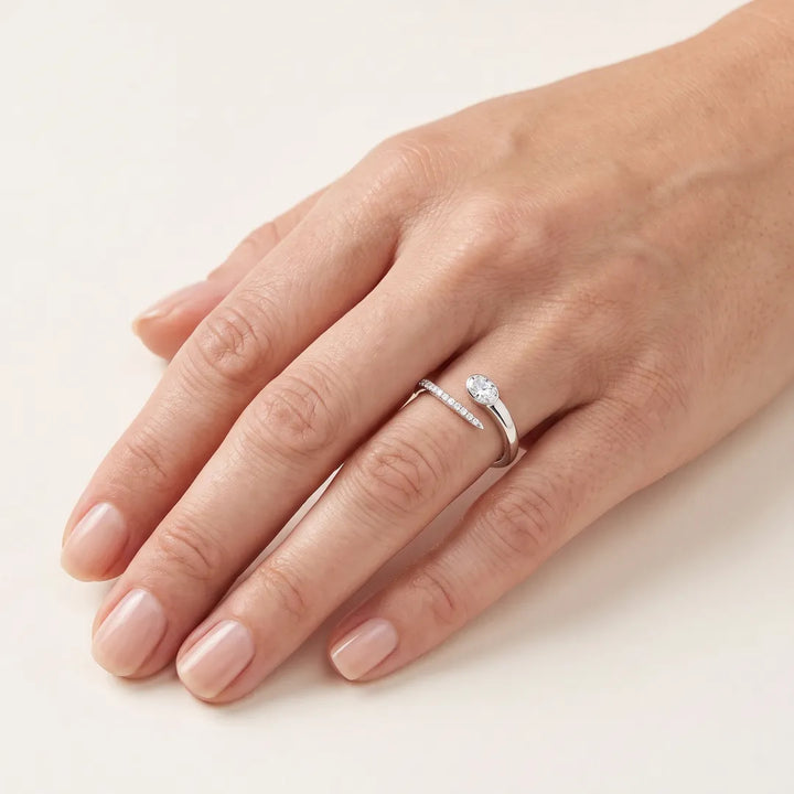 0.30ct Oval Lab Grown Diamond Open Ring in 9K White Gold worn on a model's hand