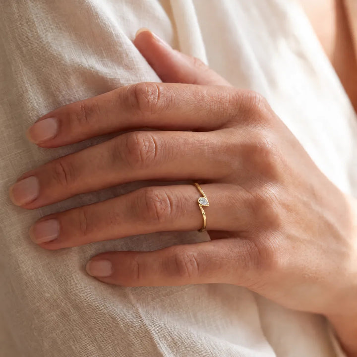 0.12ct Lab Grown Diamond Ring in 9K Yellow Gold worn on model's hand