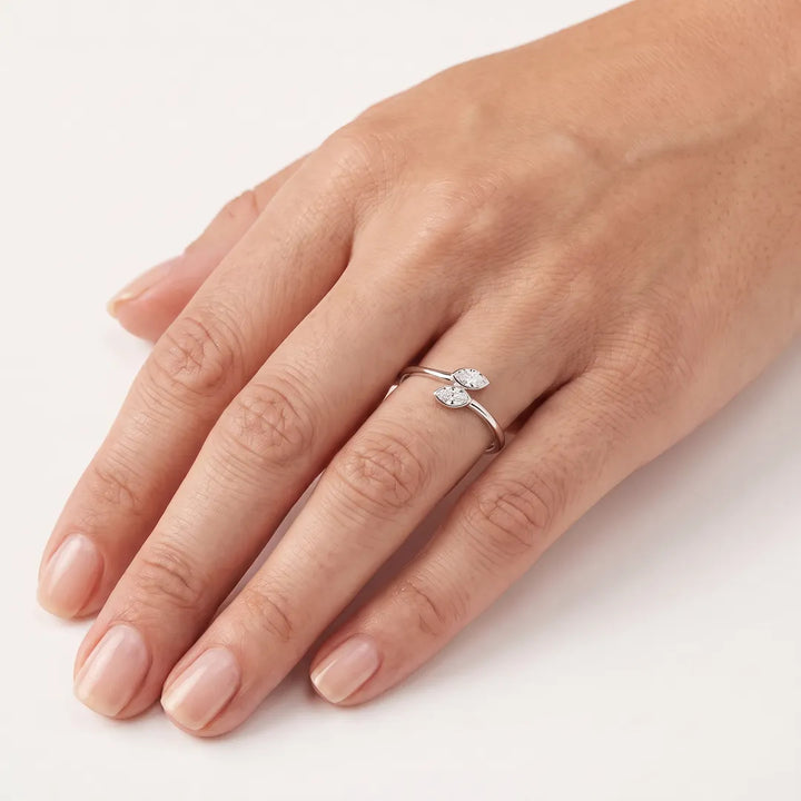 0.50ct marquise lab grown diamond open ring in 9K white gold, worn on a model's ring finger