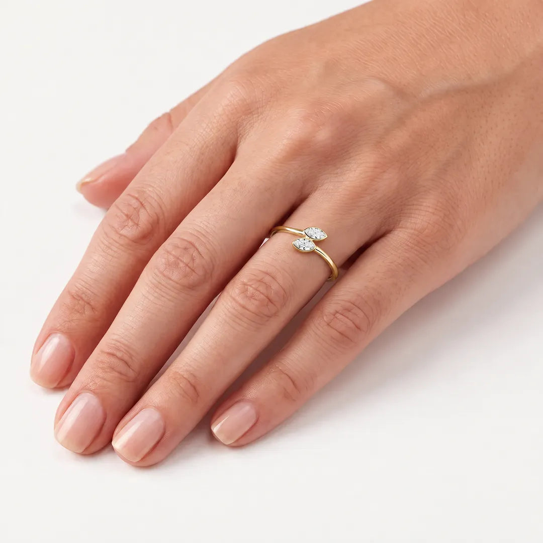 0.50ct marquise lab grown diamond open ring in 9K yellow gold, worn on a model's ring finger