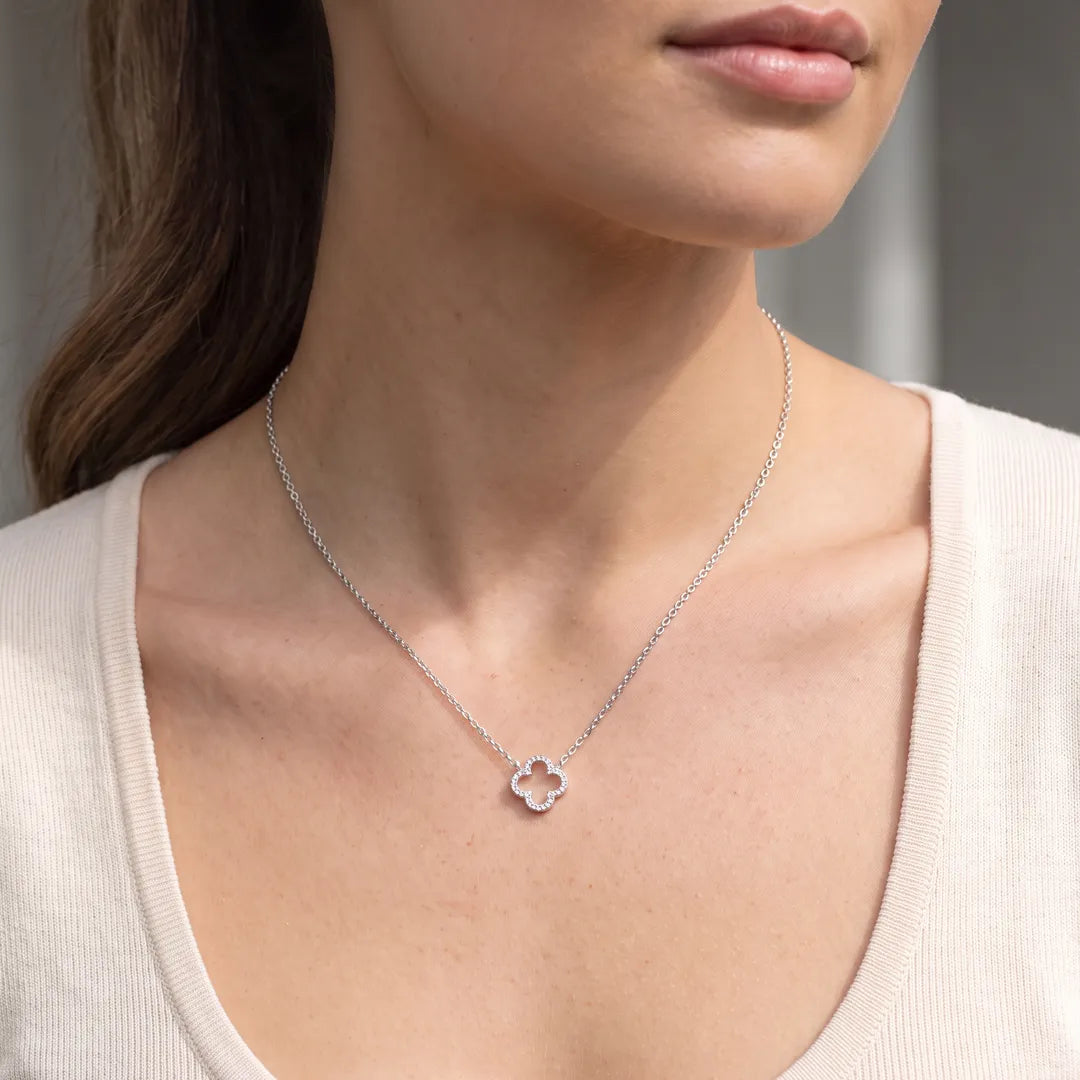 Model wearing the 0.12ct diamond clover pendant necklace in 9K white gold on a 45cm chain