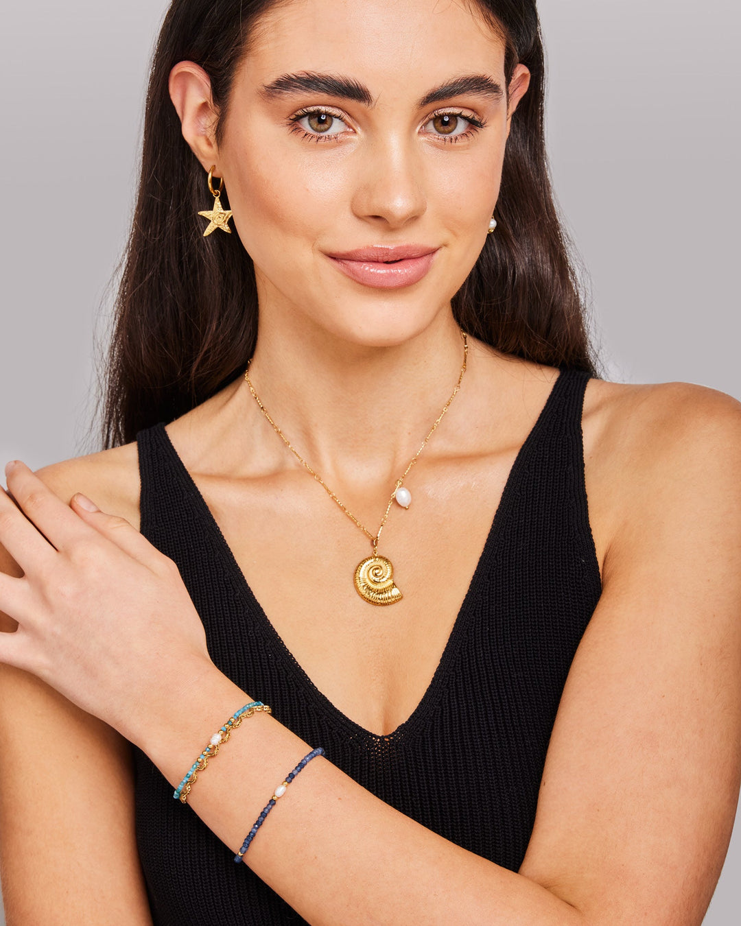 Solara Dark Blue Jade & Cultured Freshwater Pearl Bracelet styled on a model, close-up detail — Zoe Olivia