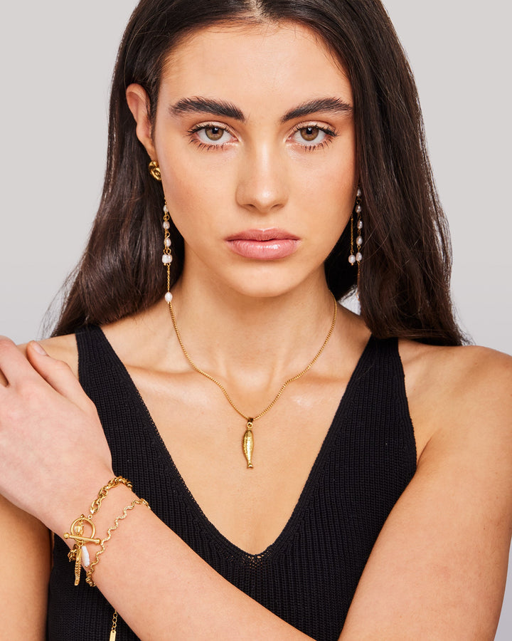 Solara Textured Wave Bracelet in Gold styled on a model — Zoe Olivia