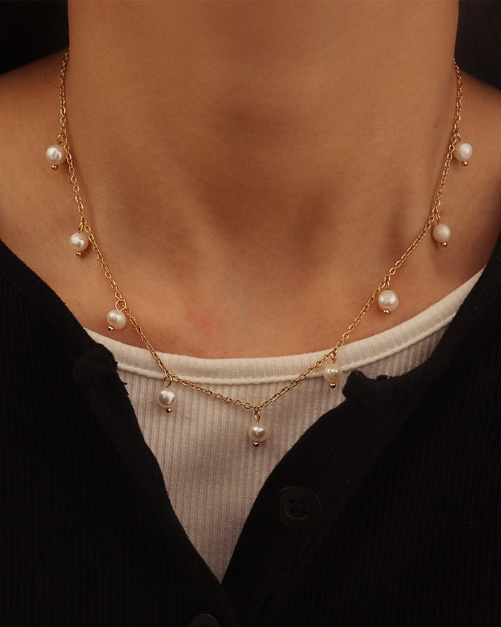 Essentials Timeless Intermittent Pearl Necklace styled on a model — Zoe Olivia
