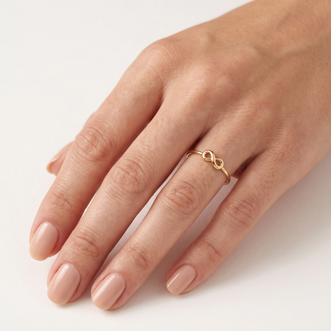 9K Yellow Gold Infinity Ring worn on hand